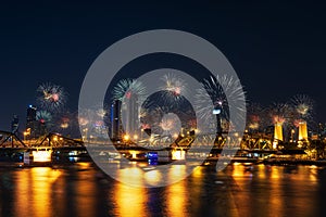 Firework New year Celebration at the Phra Phuttha Yodfa Bridge, Memorial Bridge. Bangkok Thailand -January 1,2021