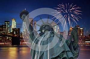 Firework over city at night with Statue of Liberty in Manhattan New York City USA s over Manhattan