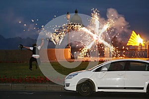 Firework, salute. Fireworks of various colors bursting against a black background.