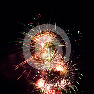 Firework streaks in night sky, celebration