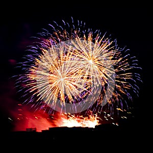 Firework streaks in night sky, celebration