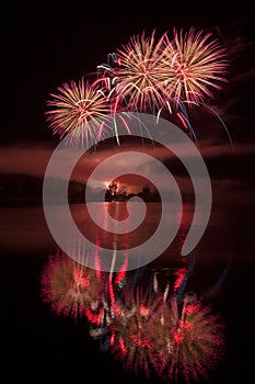 Fireworks above water, mirroring