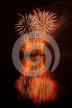 Fireworks above water, mirroring