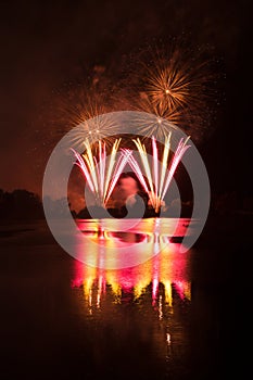 Fireworks above water, mirroring