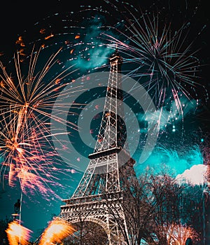 fireworks around Eiffel tower New Year in Paris
