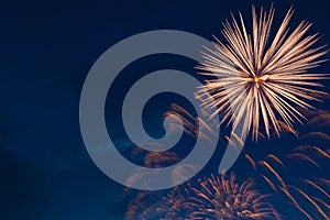 Fireworks on the background of the cloudy night sky. 4th of July - American Independence Day USA