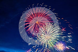 Fireworks on the background of the cloudy night sky. 4th of July - American Independence Day USA