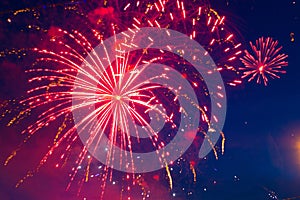 Fireworks on the background of the cloudy night sky. 4th of July - American Independence Day USA