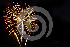 Fireworks on the black sky background with reflection on water a photo