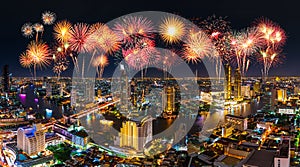 Fireworks celebrating over Chao Phraya river in Bangkok city at night, Thailand