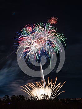 Fireworks of different colors with the black background