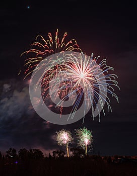 Fireworks of different colors with the black background