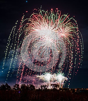 Fireworks of different colors with the black background