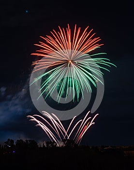 Fireworks of different colors with the black background