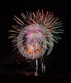 Fireworks of different colors with the black background