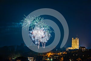 Fireworks display above the grounds of Richmond Castle, North Yorkshire with houses in the foreground