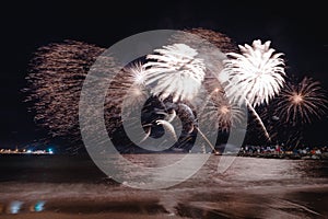 Fireworks display, night show on seafront, pyrotechnic festival. Antibes Juan les Pins