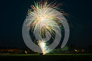 Fireworks display. Setting off fireworks in a field. photo