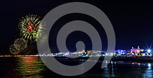 Fireworks explosion night show on seafront. Rimini photo