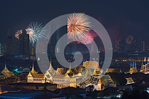 Fireworks glowing behind Grand Palace in Bangkok City, Thailand