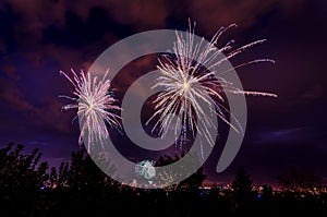 Fireworks glowing in a night sky on 4th of July in Great Falls, Montana photo