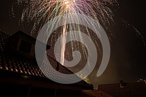 Fireworks between the houses at New Year`s Eve