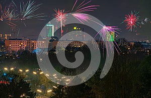 Fireworks at the illuminated city of Munich at night.