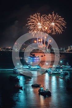 Fireworks international colorful Pattaya beach cityscape at night scene for advertise traveling event holiday.