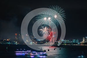 Fireworks international colorful Pattaya beach cityscape at night scene for advertise traveling event holiday.