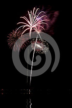 Fireworks with lake reflection