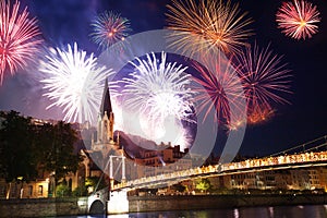 Fireworks light up Lyon sky over the Saone river photo