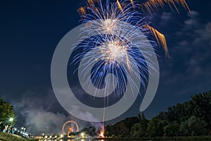 Fireworks of the Maidult with Ferris wheel in Regensburg, Germany