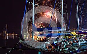 Fireworks at night, the salute of victory day at main quayside in Yalta, on seashore of Crimea