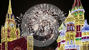 Fireworks over the Christmas decoration on the area of the Kiyevskaya Kiyevsky Railway Station at night, Moscow, Russia