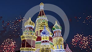 Fireworks over the Christmas decoration on the area of the Kiyevskaya Kiyevsky Railway Station at night, Moscow, Russia