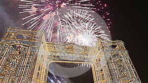 Fireworks over the Christmas illumination light gates/arches installations of Journey to Christmas in Moscow, Russia