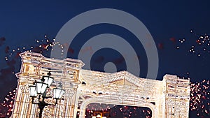 Fireworks over the Christmas illumination light gates/arches installations of Journey to Christmas in Moscow, Russia