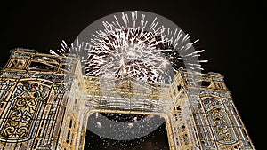 Fireworks over the Christmas illumination light gates/arches installations of Journey to Christmas in Moscow, Russia