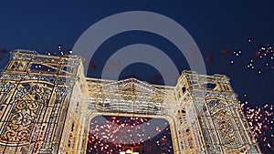 Fireworks over the Christmas illumination light gates/arches installations of Journey to Christmas in Moscow, Russia