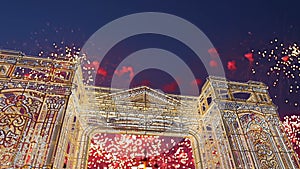 Fireworks over the Christmas illumination light gates/arches installations of Journey to Christmas in Moscow, Russia with zoom