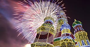 Fireworks over the Christmas New Year holidays decoration in Moscow at night, Russia