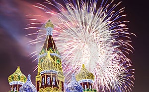 Fireworks over the Christmas New Year holidays decoration in Moscow at night, Russia