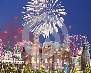 Fireworks over the Christmas New Year holidays illumination and State Historical Museum inscription in Russian,Moscow, Russia