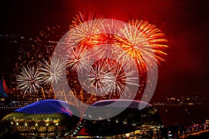 Fireworks over Marina bay in Singapore on New Years Eve. View from the Swissôtel The Stamford Hotel to the Esplanade