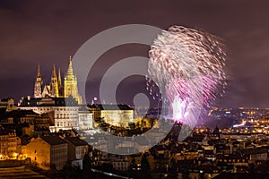 Fireworks over the Old Town of Prague, Czech Republic. New Year fireworks in Prague, Czechia. Prague fireworks during New Year