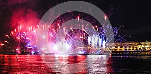 Fireworks over the river. Bright laser show. Holiday in the city