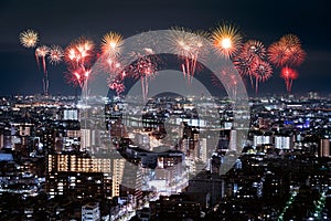 Fireworks over Tokyo cityscape at night, Japan