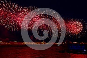 Fireworks over the water Holiday light. Night cityscape scene. Neva river, Saint-Petersburg, Russia. Holiday Scarlet Sails