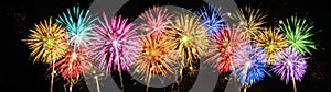 Fireworks pyrotechnics celebration party event festival holiday or New Year background panorama - Colorful firework on dark night