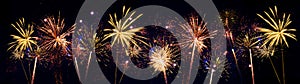 Fireworks pyrotechnics celebration party event festival holiday or New Year background panorama - Colorful firework on dark night